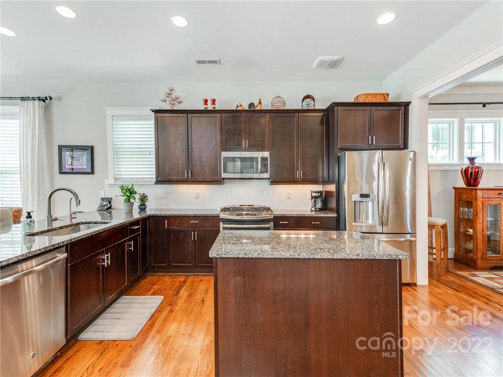 326 Mariemont Way Rock Hill, SC 29730 - Photo 10 of 36 a large kitchen with stainless steel appliances granite countertop a refrigerator a stove and a sink