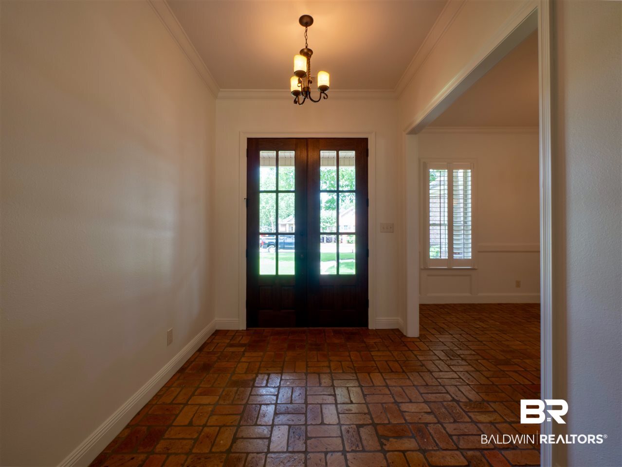379 Lambton Street Fairhope, AL 36532 - Photo 19 of 25 with double wooden doors and a scored porch