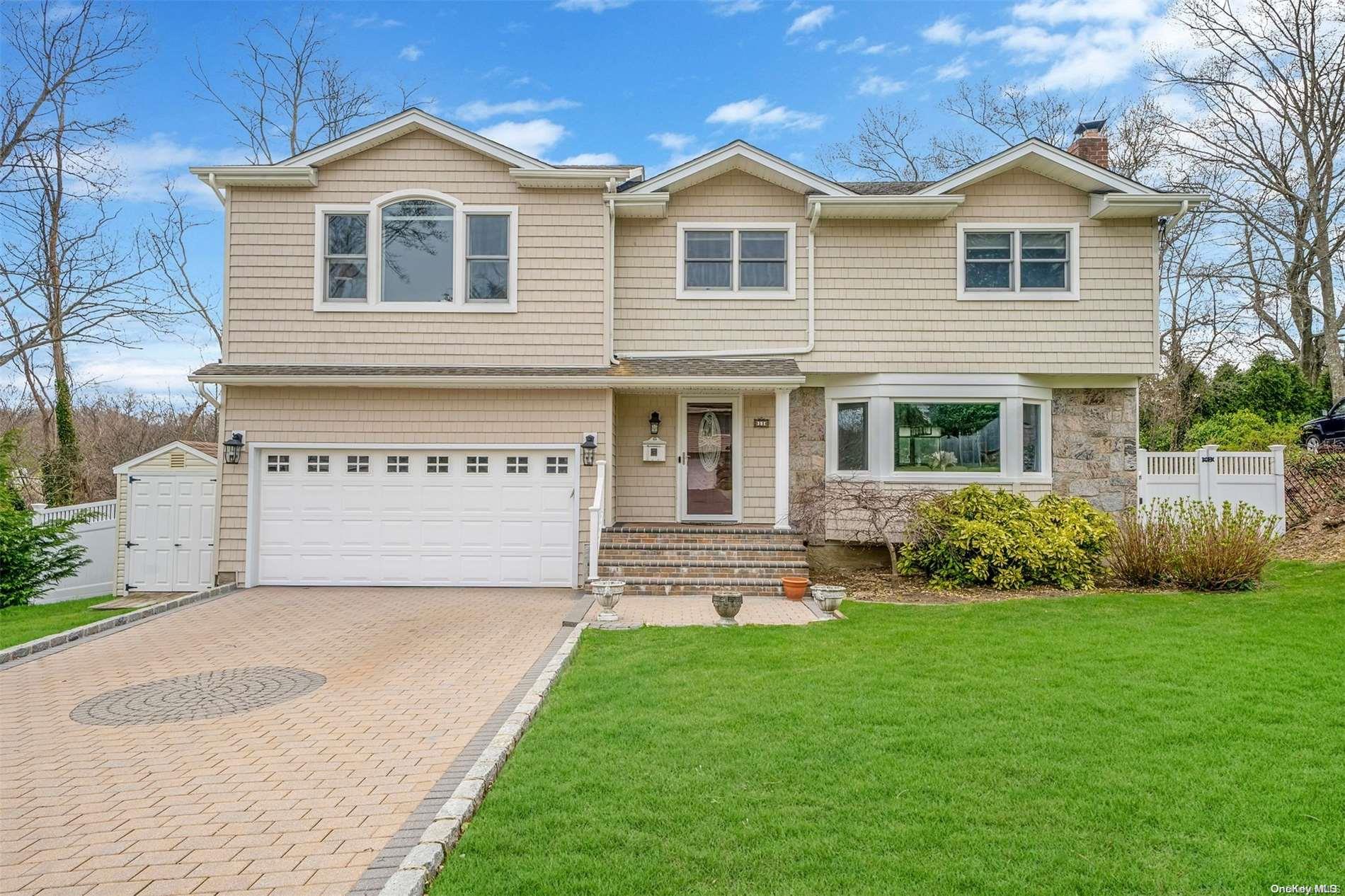 11 High Ridge Road Plainview, NY 11803 - Photo 1 of 1 a front view of a house with a garden