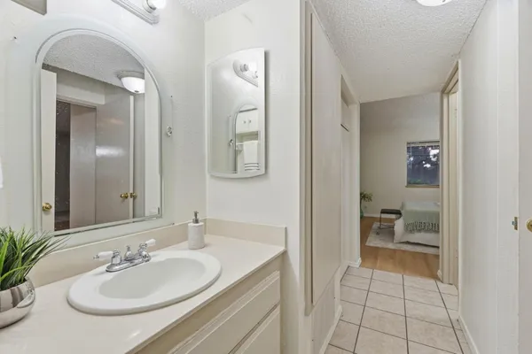 a en suite bathroom with a sink and a mirror