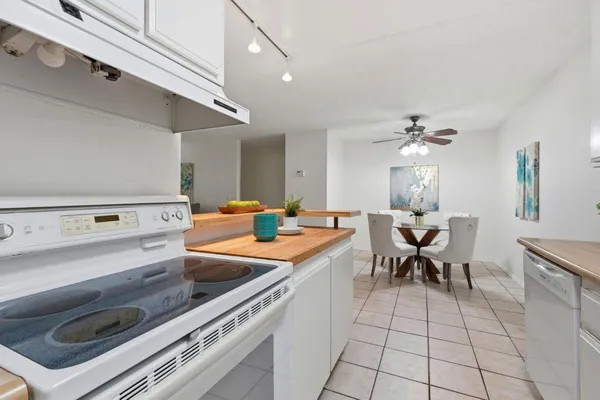 a kitchen with a sink cabinets and appliances