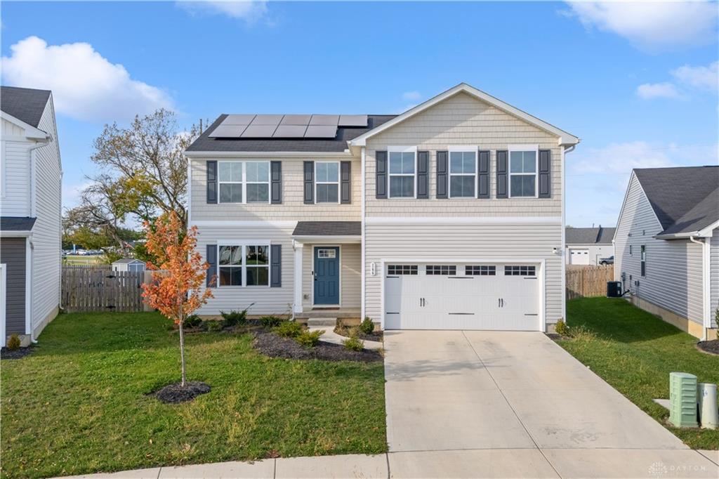 166 Chesapeake Circle Springfield, OH 45505 - Photo 2 of 15 This two-story residence features a welcoming facade with a front-facing garage and a well-maintained lawn.