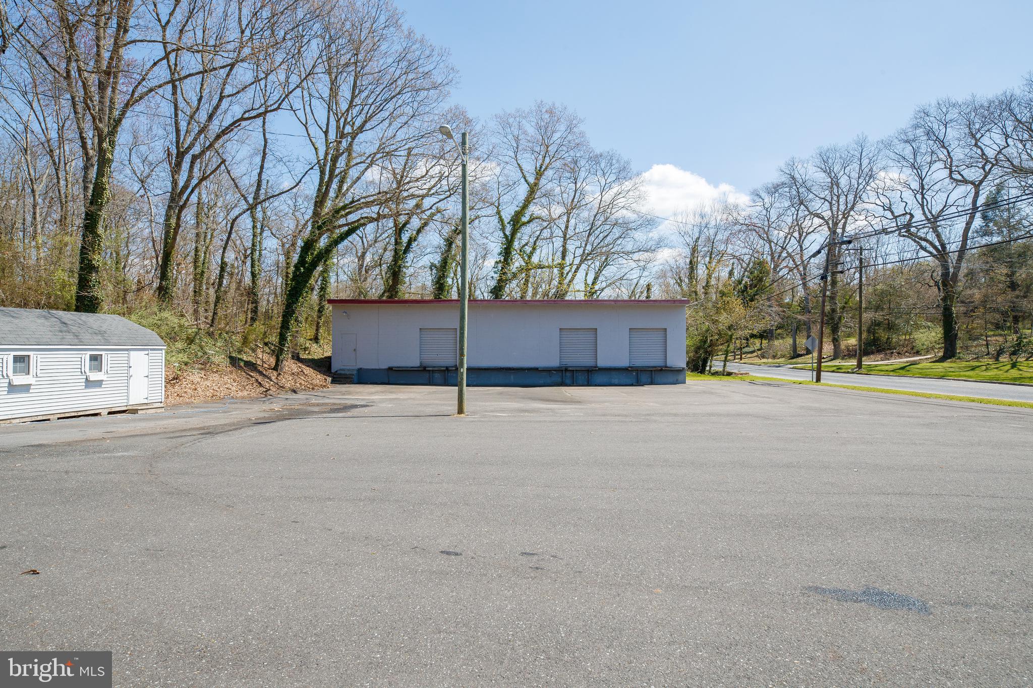145 Roadstown Road Bridgeton, NJ 08302 - Photo 16 of 50 Parking lot and warehouse