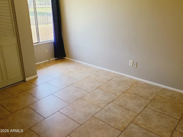 a view of an empty room and a window