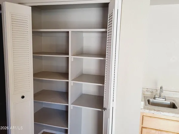 a kitchen with a refrigerator and sink