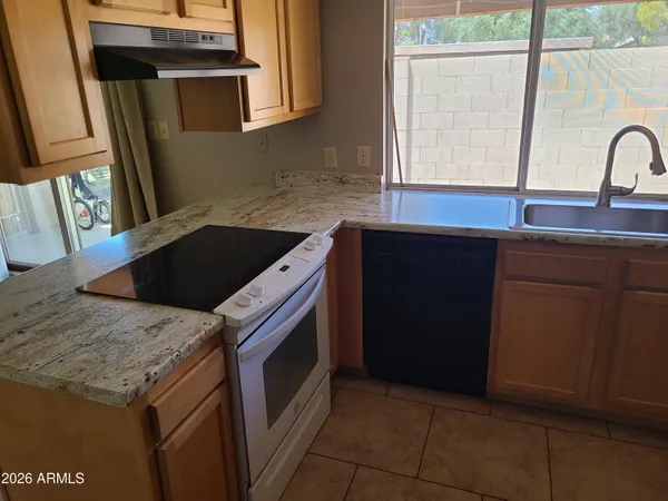 a kitchen with a stove and a sink