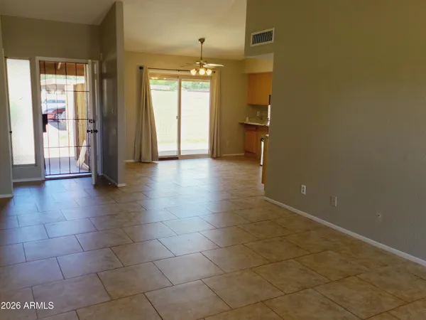 a view of a hallway with wooden shelves