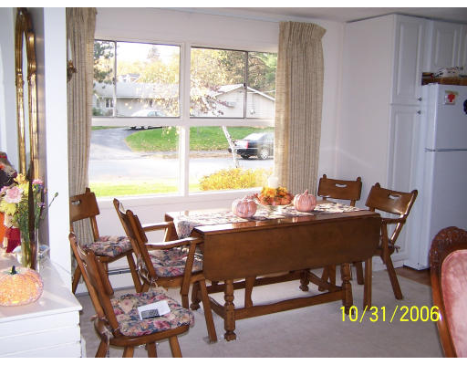 31 Irving Road Natick, MA 01760 - Photo 3 of 12 a view of a dining room with furniture window and outside view