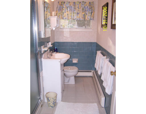 31 Irving Road Natick, MA 01760 - Photo 7 of 12 a bathroom with a sink toilet and mirror