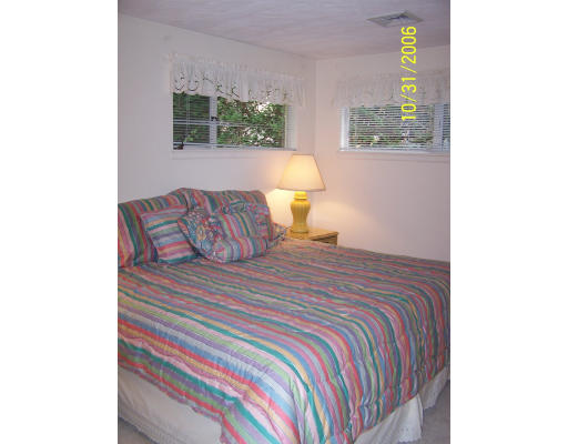 31 Irving Road Natick, MA 01760 - Photo 8 of 12 a bedroom with a bed and a window