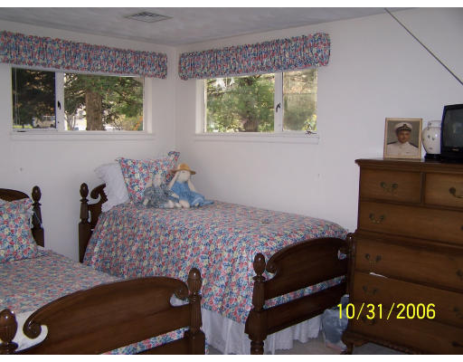 31 Irving Road Natick, MA 01760 - Photo 9 of 12 a bedroom with a bed and a window