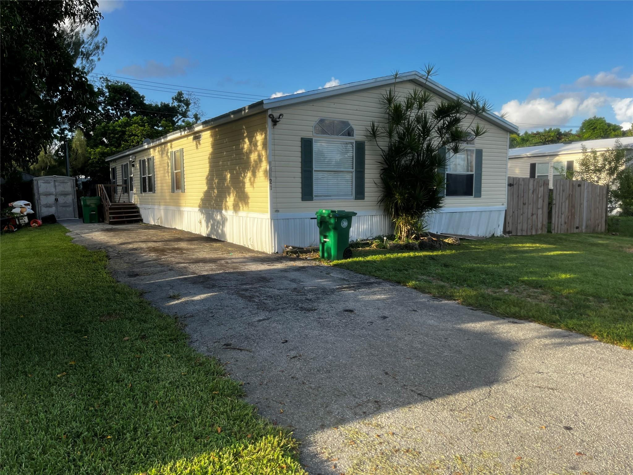 Undisclosed Address Davie, FL 33325 - Photo 2 of 19 a view of a house next to a yard
