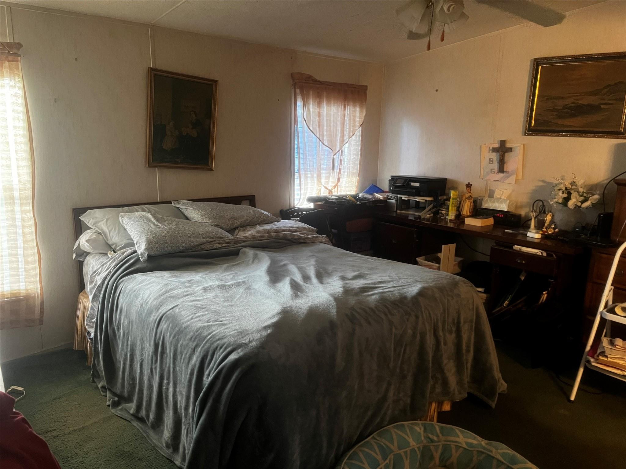 Undisclosed Address Davie, FL 33325 - Photo 9 of 19 a bed sitting in a bedroom next to a window