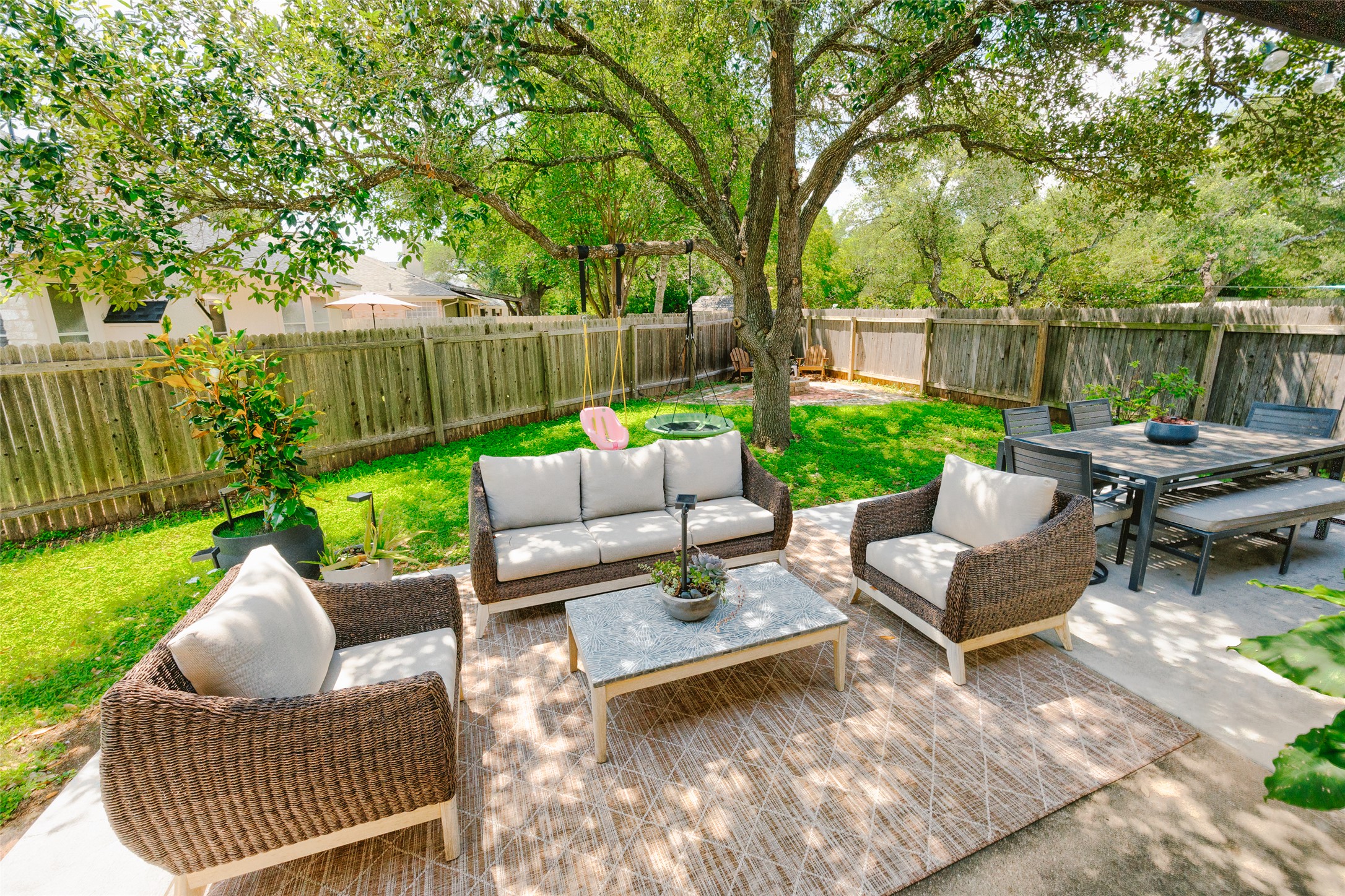 2202 Old Mill Road Cedar Park, TX 78613 - Photo 19 of 23 Relax in this inviting outdoor area, perfect for dining and enjoying the lush, shaded yard.