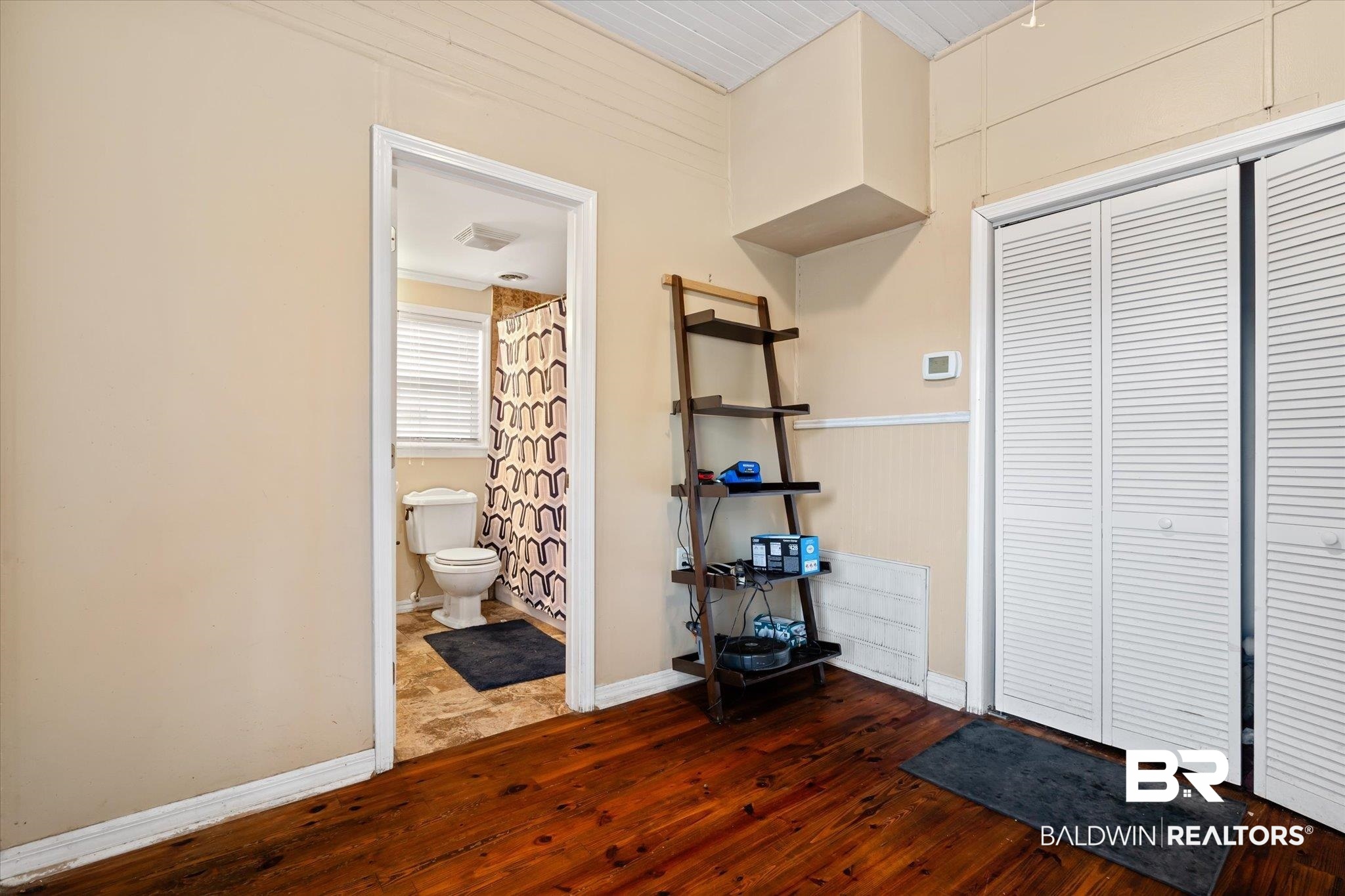 7 Rickarby Place Mobile, AL 36606 - Photo 16 of 20 Unfurnished bedroom featuring dark hardwood / wood-style floors and ensuite bath