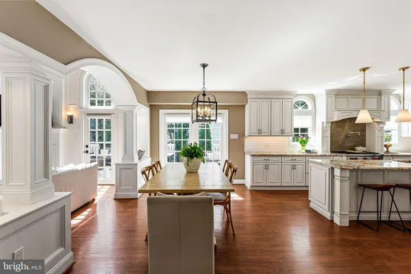 a living room with fireplace furniture and a wooden floor