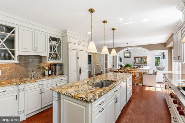 a kitchen with counter top space appliances and cabinets