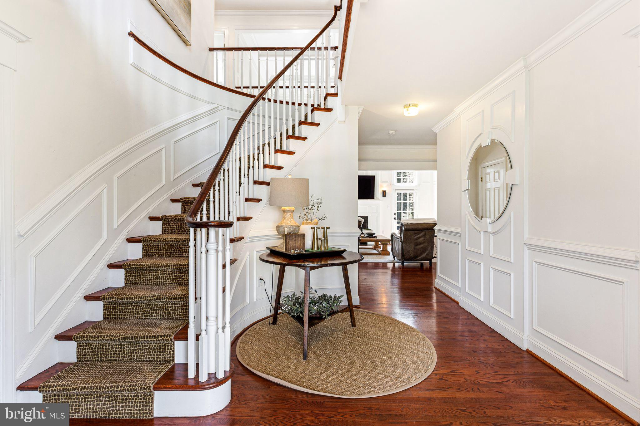 380 Kings Highway West Haddonfield, NJ 08033 - Photo 2 of 50 a living room with wooden floor and a dining table
