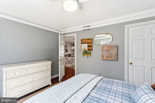 a bedroom with a bed and a cabinets