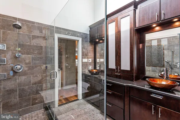 a bedroom with a bed and a dresser in it