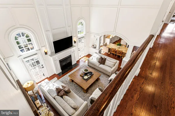 a view of staircase with railing and white walls