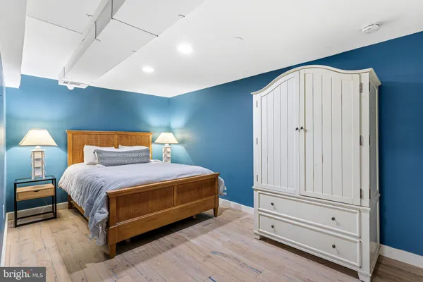 a bedroom with a bed and a bathroom