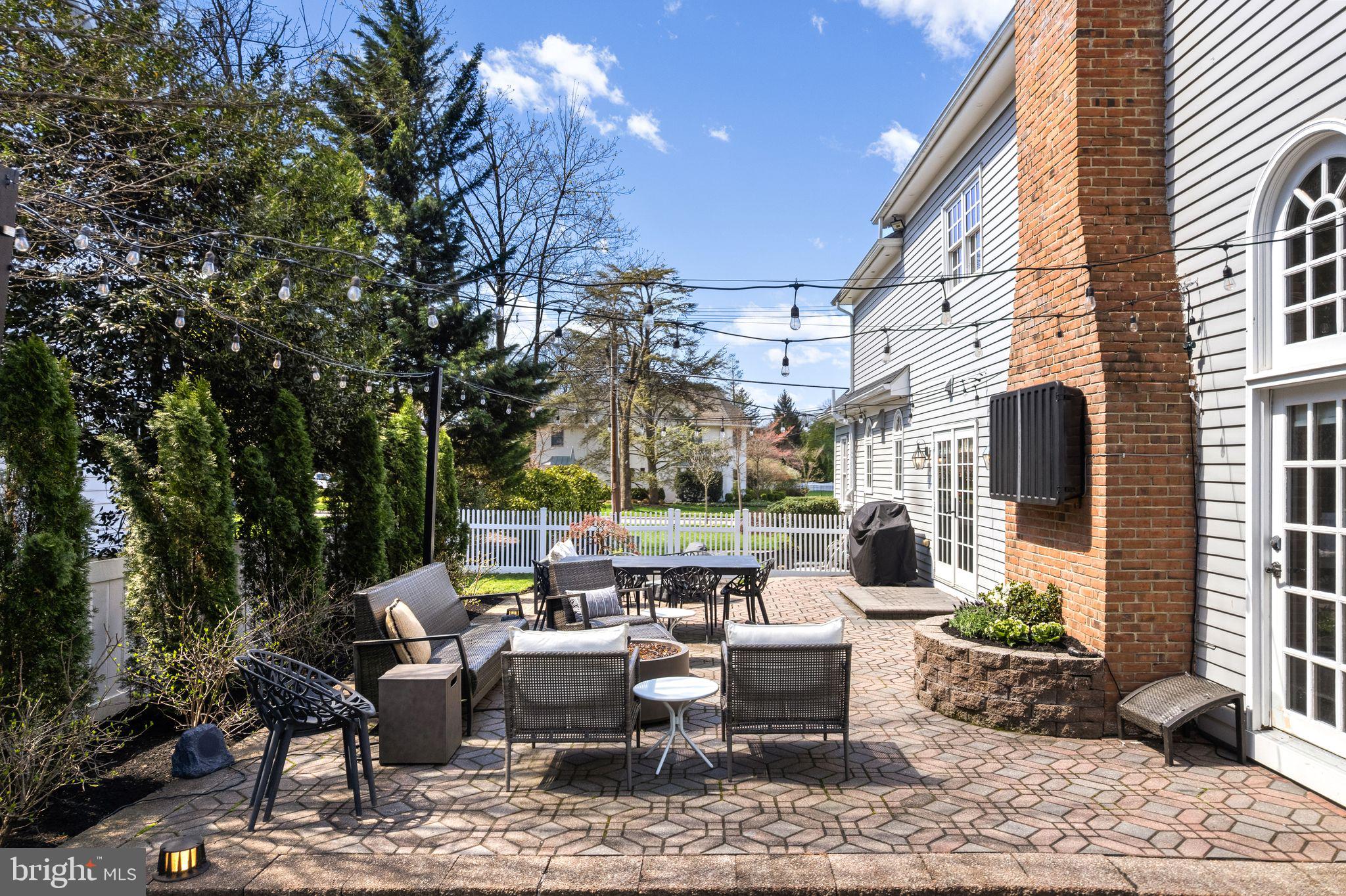 380 Kings Highway West Haddonfield, NJ 08033 - Photo 46 of 50 a view of a patio with couches table and chairs and potted plants