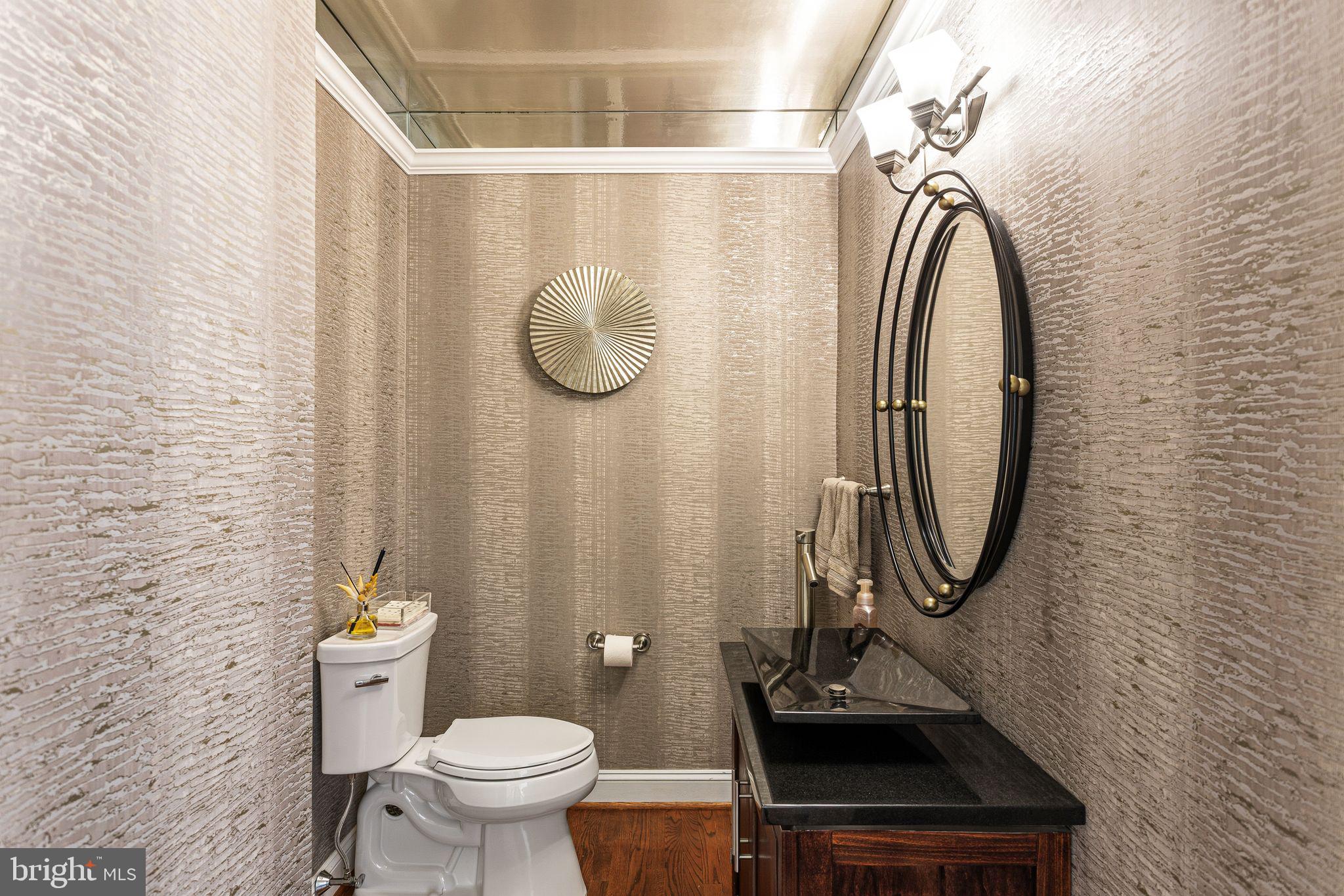380 Kings Highway West Haddonfield, NJ 08033 - Photo 8 of 50 a bathroom with a sink a toilet and a mirror