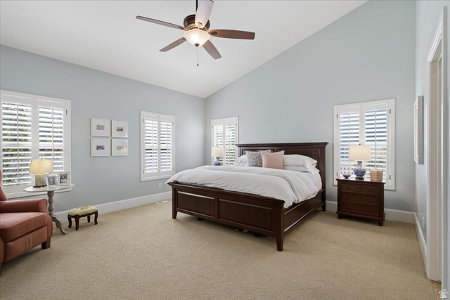 1257 Rigby Road Kaysville, UT 84037 - Photo 26 of 55 Room featuring vaulted ceilings, a ceiling fan with integrated lighting, and multiple windows with plantation shutters