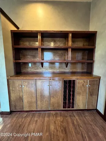 a view of a room with wooden floor
