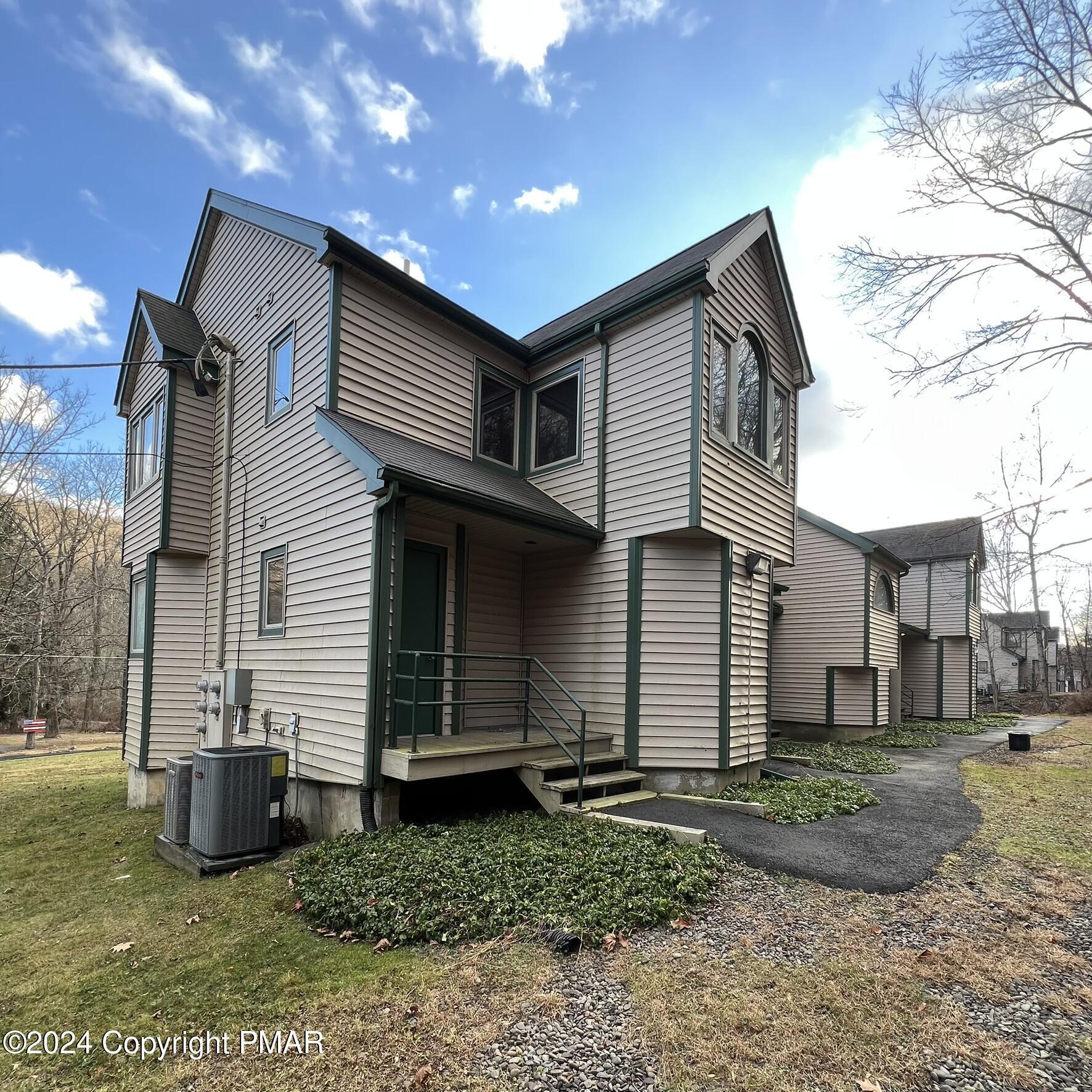 316 Hollow Road East Stroudsburg, PA 18302 - Photo 4 of 45 a front view of a house with a yard