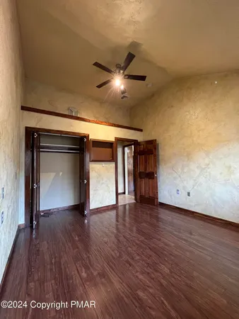a view of a livingroom with wooden floor