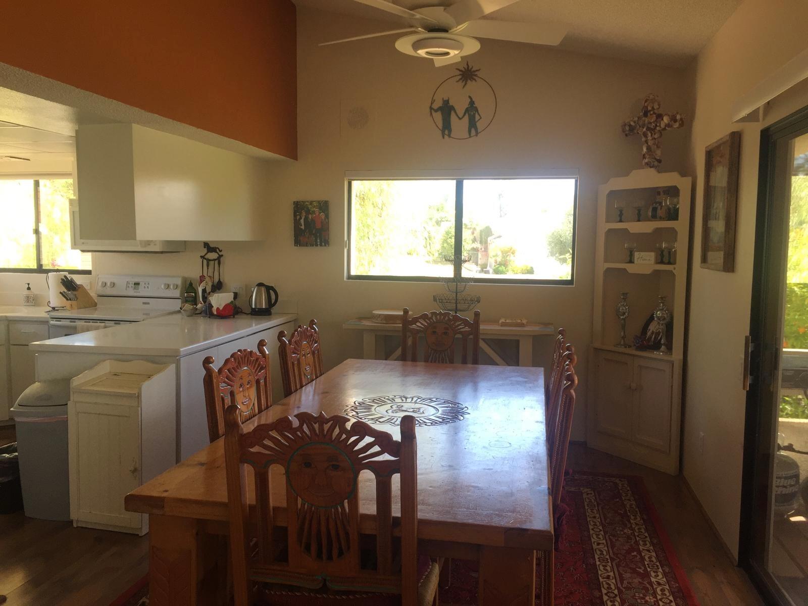 8 Mission Court Rancho Mirage, CA 92270 - Photo 15 of 17 a view of a dining room with furniture window and wooden floor