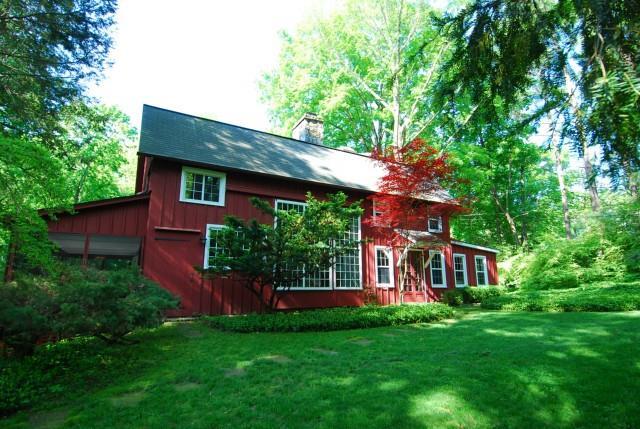 439 Ridgefield Road Wilton, CT 06897 - Photo 1 of 1 a view of a house with a yard potted plants and large tree