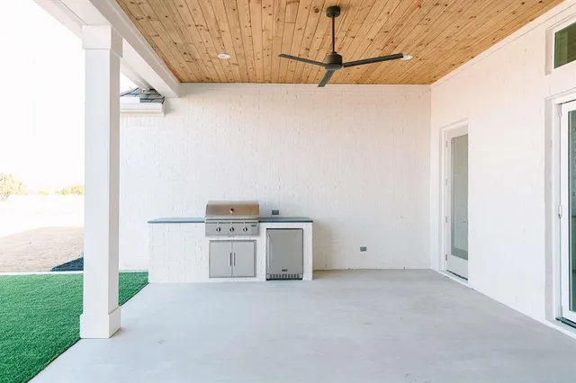 a view of a kitchen with a sink and dishwasher