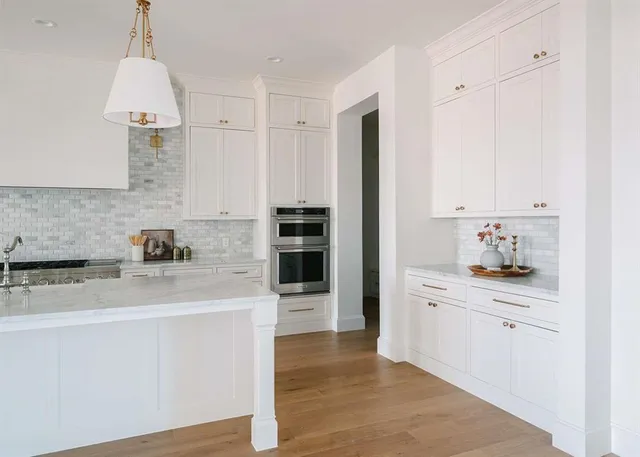 a kitchen with stainless steel appliances a sink stove and refrigerator