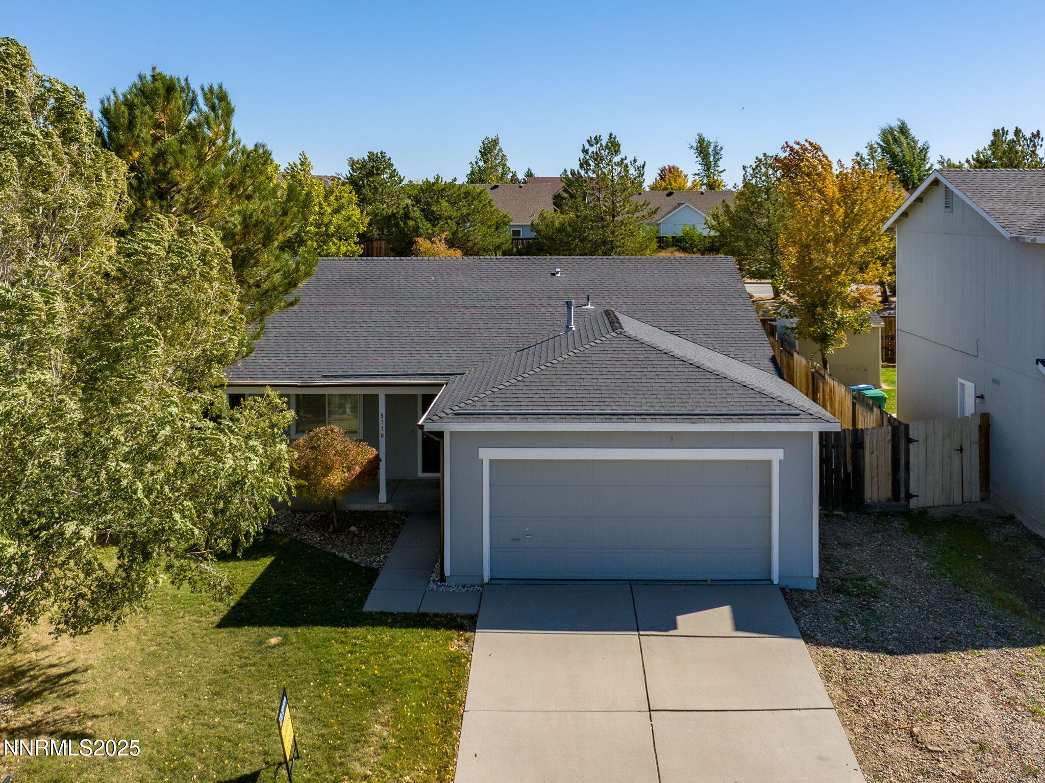 a aerial view of a house with a yard