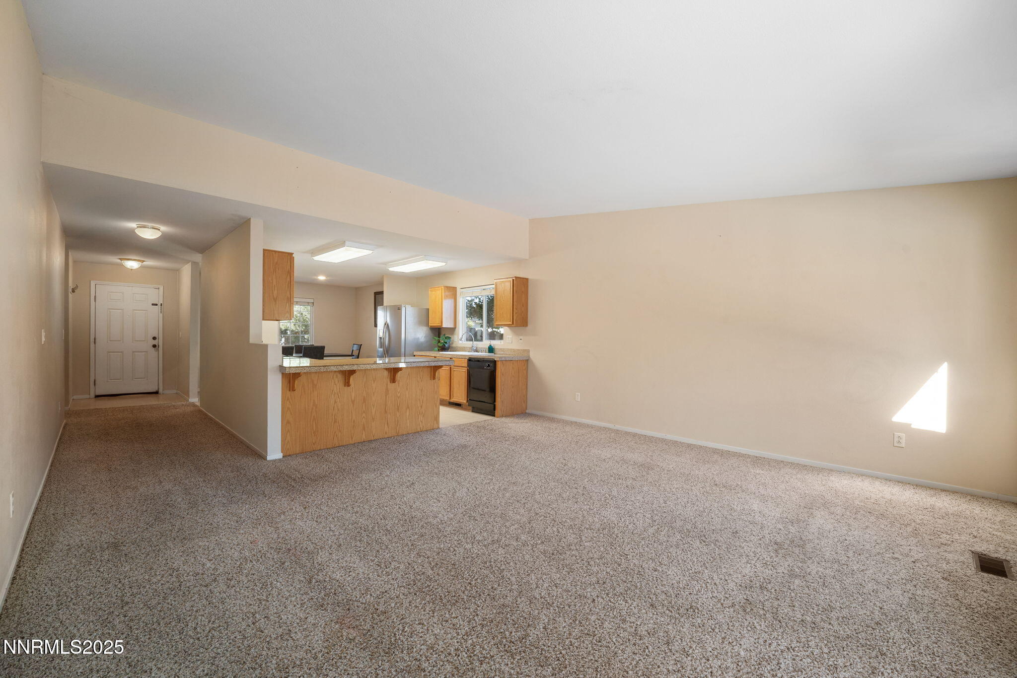 9770 Brightridge Drive Reno, NV 89506 - Photo 12 of 43 a view of a kitchen with a sink and a refrigerator