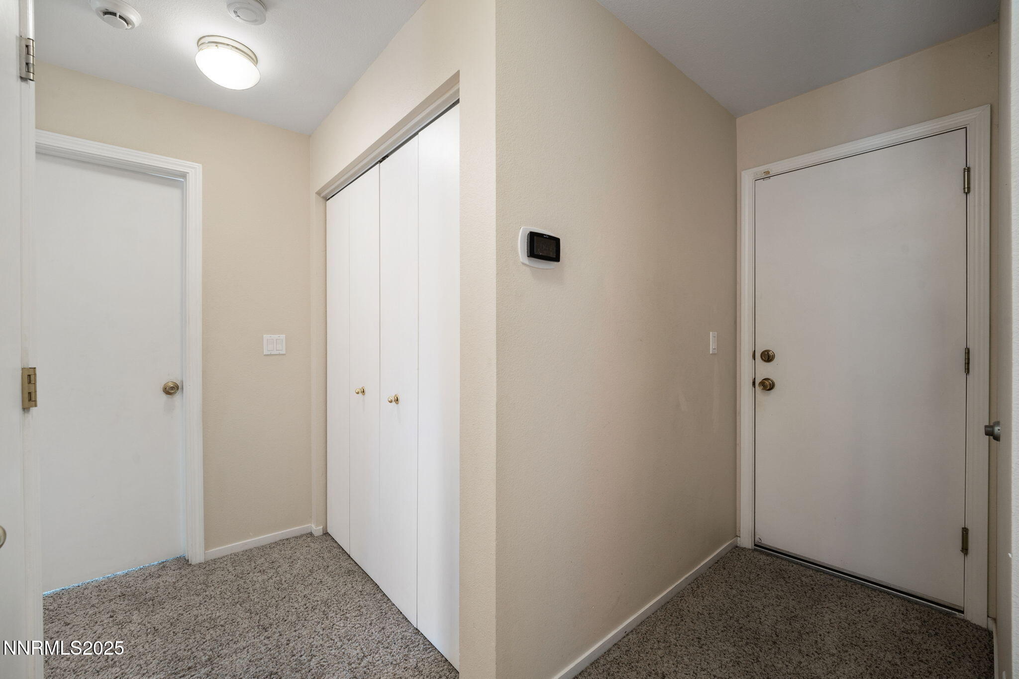 9770 Brightridge Drive Reno, NV 89506 - Photo 15 of 43 a view of hallway with closet and a window