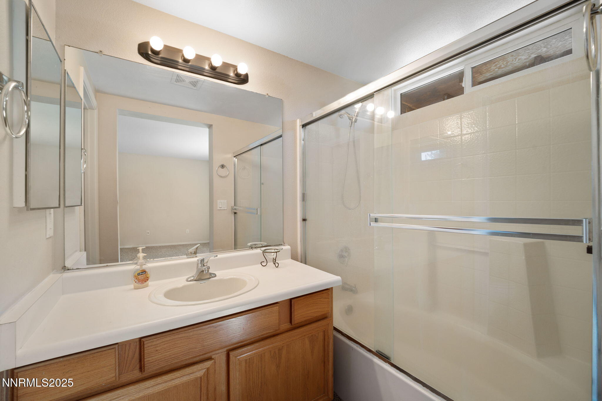 9770 Brightridge Drive Reno, NV 89506 - Photo 23 of 43 a bathroom with a sink and a mirror