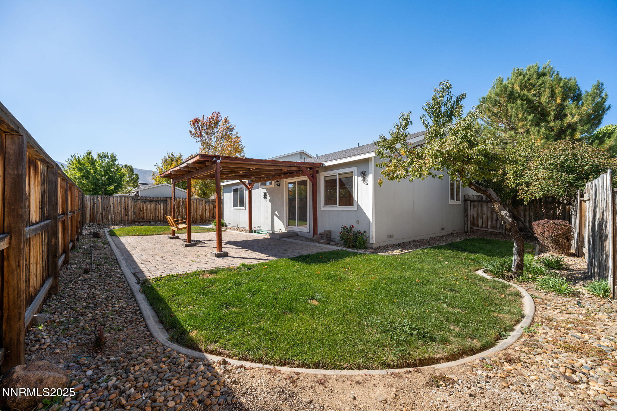 9770 Brightridge Drive Reno, NV 89506 - Photo 26 of 43 a view of a backyard with a garden