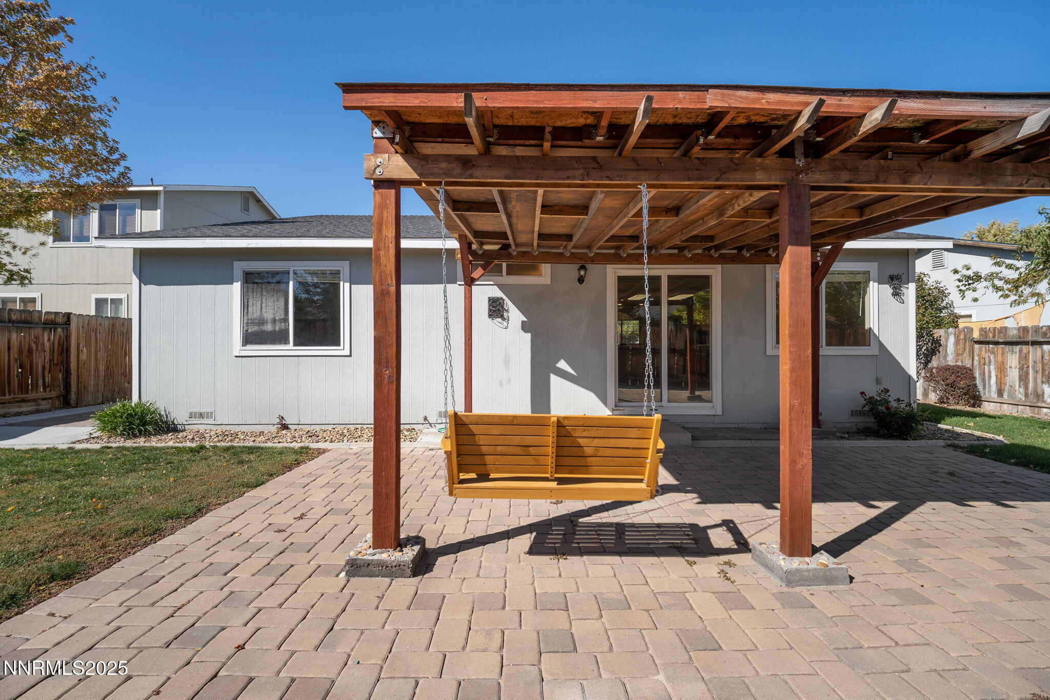 9770 Brightridge Drive Reno, NV 89506 - Photo 27 of 43 a view of house with backyard and glass door