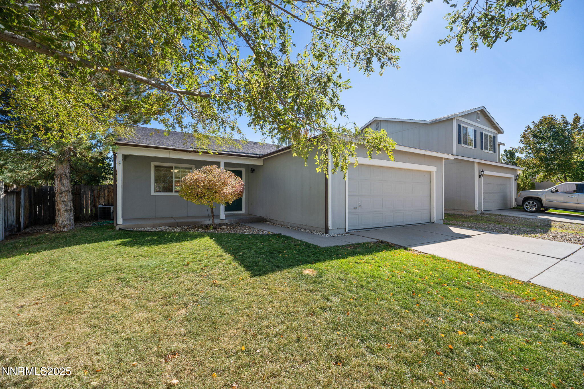 9770 Brightridge Drive Reno, NV 89506 - Photo 33 of 43 a front view of a house with a yard and garage
