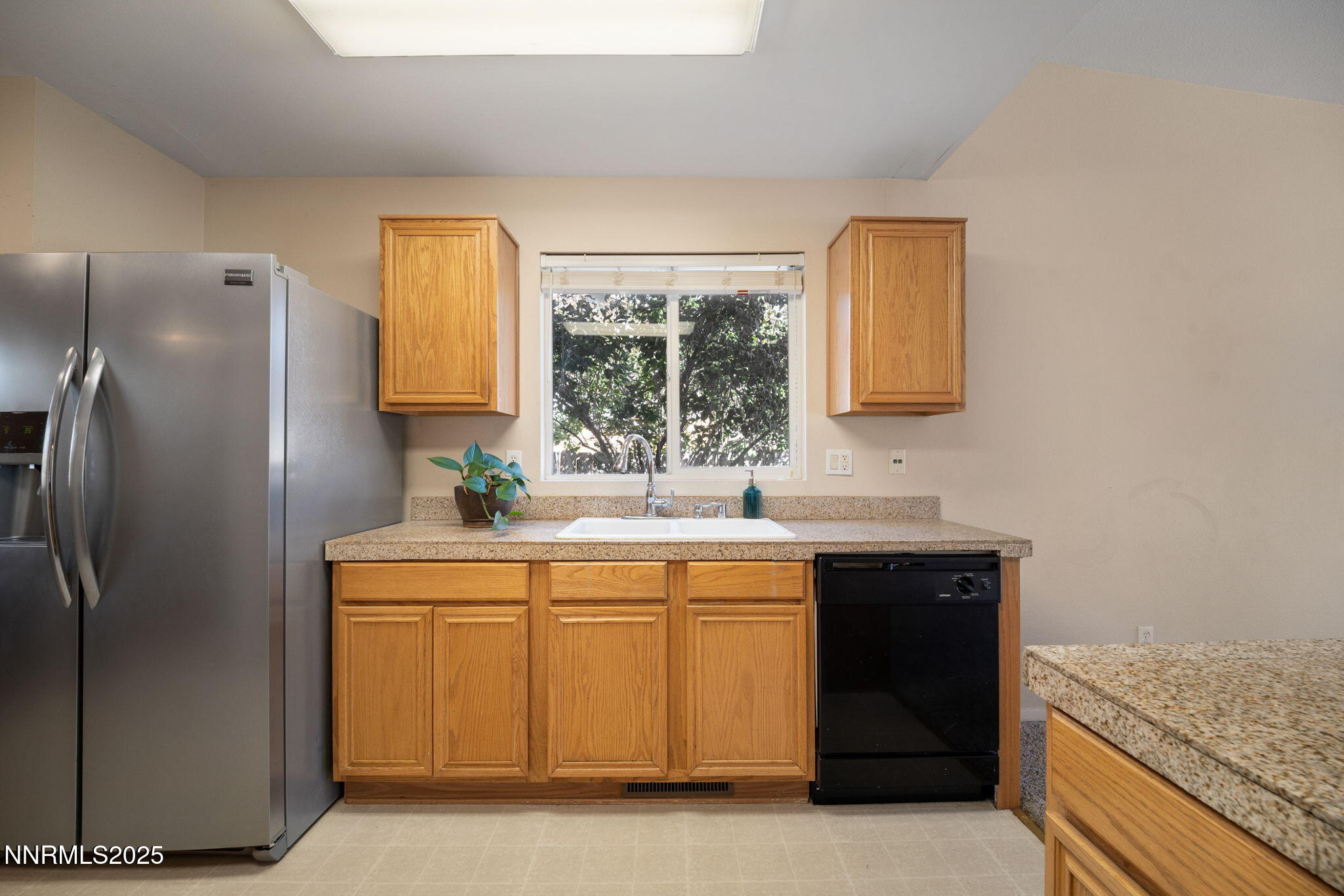 9770 Brightridge Drive Reno, NV 89506 - Photo 7 of 43 a kitchen with a sink and cabinets