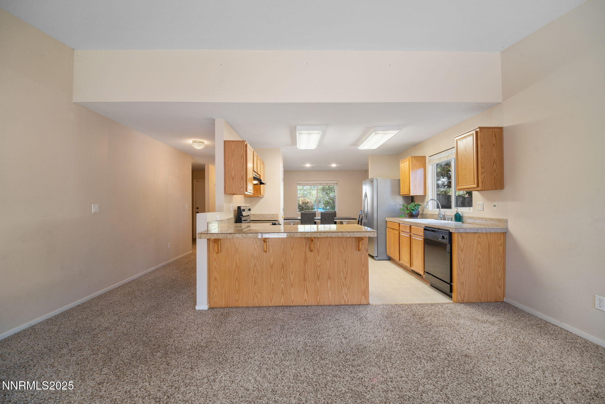 9770 Brightridge Drive Reno, NV 89506 - Photo 10 of 43 a view of kitchen with kitchen island and stainless steel appliances