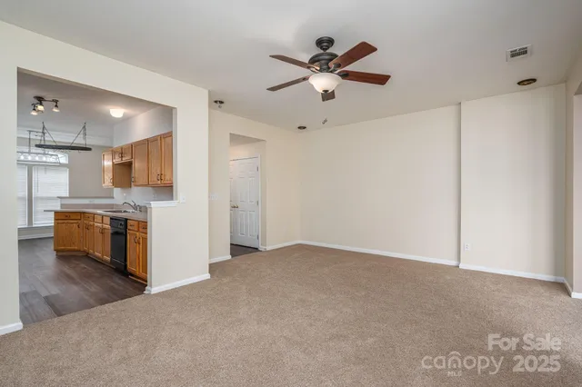 a view of a kitchen with a sink and a window