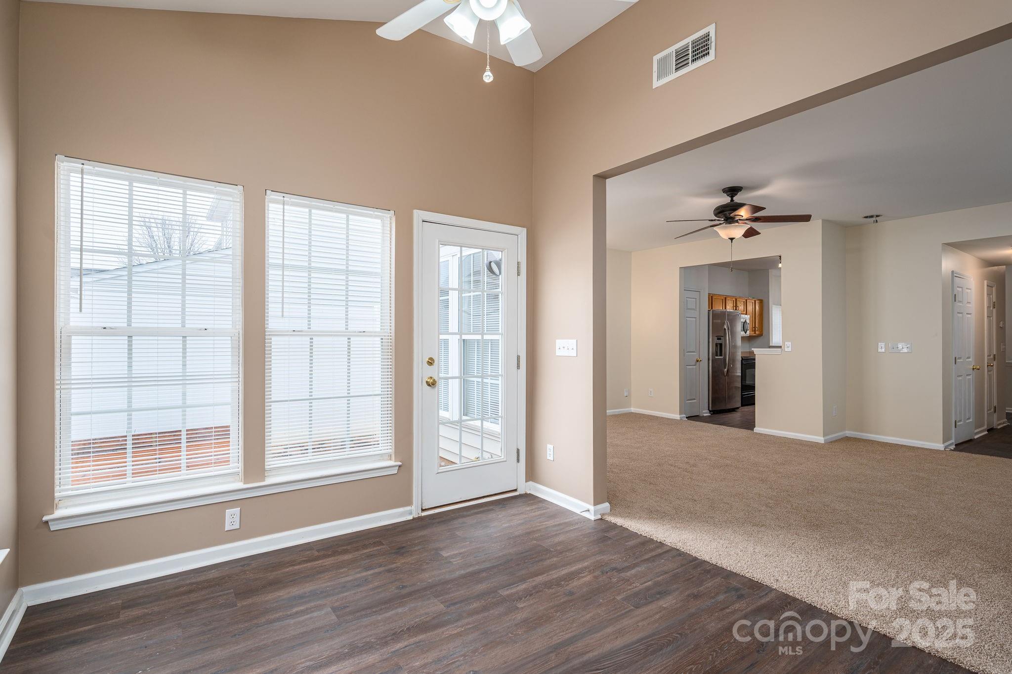 7937 Mariners Pointe Circle Denver, NC 28037 - Photo 17 of 38 a view of a big room with wooden floor and windows