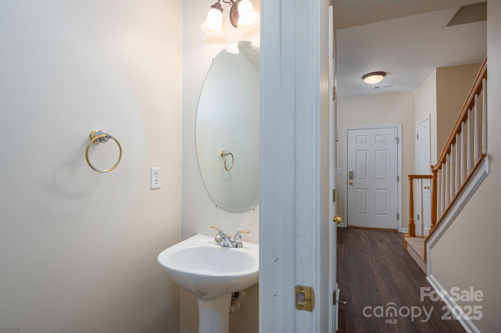 7937 Mariners Pointe Circle Denver, NC 28037 - Photo 18 of 38 a bathroom with a sink and mirror