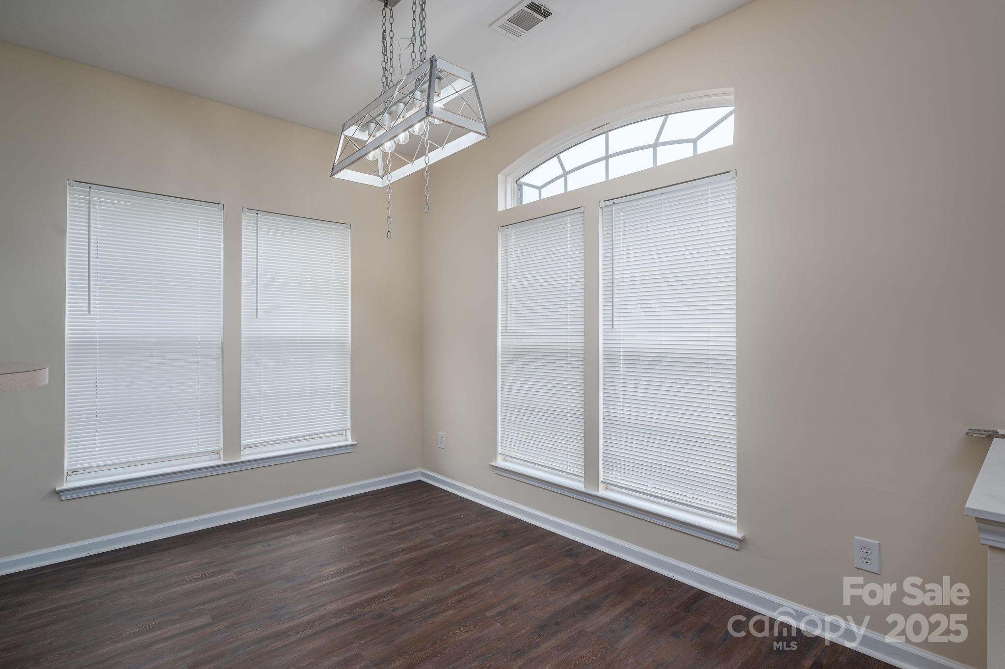 7937 Mariners Pointe Circle Denver, NC 28037 - Photo 3 of 38 wooden floor in an empty room with a window