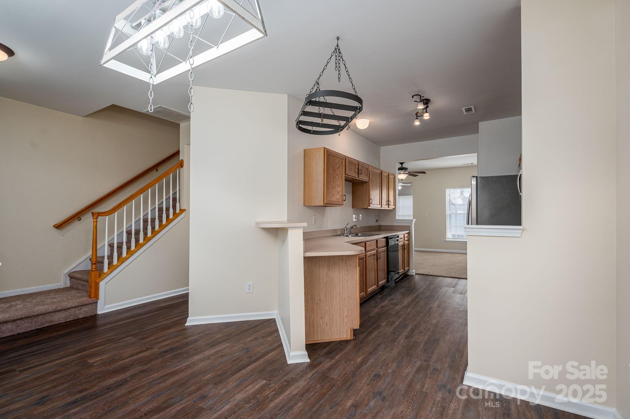 7937 Mariners Pointe Circle Denver, NC 28037 - Photo 5 of 38 a kitchen with stainless steel appliances a white refrigerator and a stove top oven